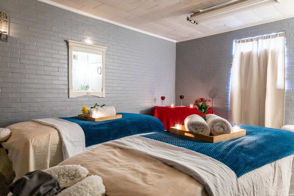 Two soft blush spa robes side by side by a bright window